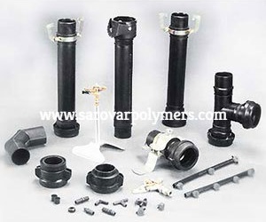 Black sprinkler-pipe fittings and connectors arranged on a light background